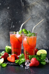 Cold summer strawberry cocktail with lime and basil in a  glasses . - 781941756
