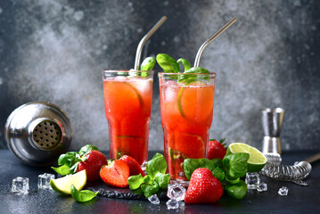 Cold summer strawberry cocktail with lime and basil in a  glasses . - 781942187