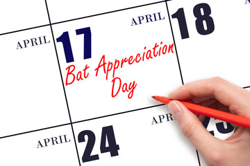 April 17. Hand writing text Bat Appreciation Day on calendar date. Save the date.
