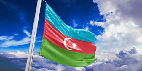 Azerbaijan national flag cloth fabric waving on beautiful Blue Sky Background.