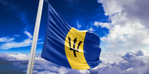 Barbados national flag cloth fabric waving on beautiful Blue Sky Background.