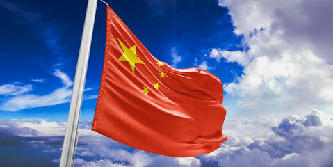 China national flag cloth fabric waving on beautiful Blue Sky Background.