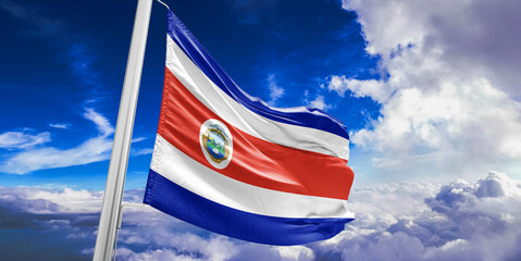 Costa Rica national flag cloth fabric waving on beautiful Blue Sky Background.
