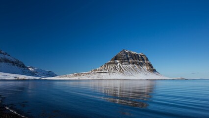 Majestic Kirkjufell Hill in Iceland, seen from the shore - Powered by Adobe