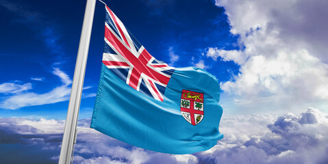 Fiji national flag cloth fabric waving on beautiful Blue Sky Background.