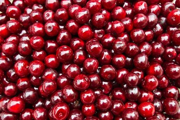 Cherries, small and vibrant, gleam with crimson allure, their sweetness encapsulating the essence...