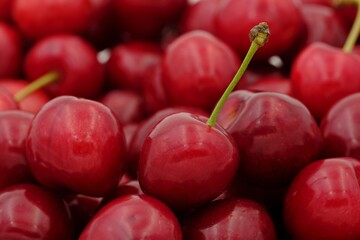 Cherry: Small, round fruit with a vibrant red color, sweet taste, and a distinct stem, often used...