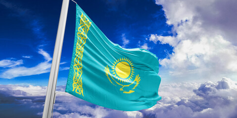 Kazakhstan national flag cloth fabric waving on beautiful Blue Sky Background.