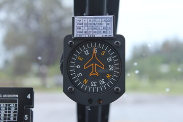 Focus on the aircraft compass in the helicopter.