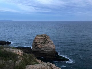Scenic view of a coastal rock found on Bangchui island with a beautiful seascape on the horizon