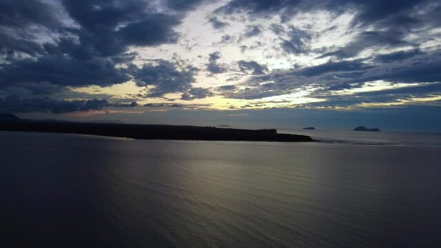 Aerial video of a beautiful sunset at Pasir Pandak beach, Santubong Sarawak, Malaysia