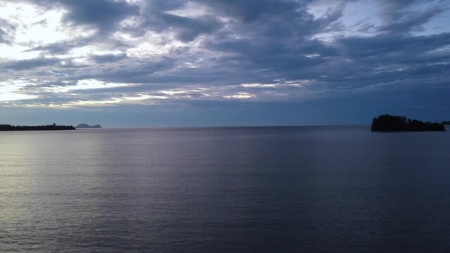 Aerial time lapse video of a beautiful sunset at Pasir Pandak beach, Santubong Sarawak, Malaysia