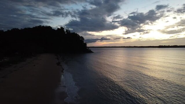 Aerial video of a beautiful sunset at Pasir Pandak beach, Santubong Sarawak, Malaysia