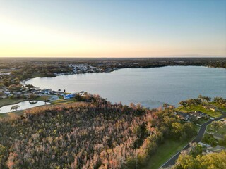 Aerial view of a lake surrounded by trees and houses in Dunmanway, West Cork