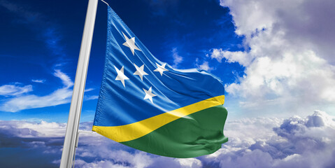Solomon Islands national flag cloth fabric waving on beautiful Blue Sky Background.