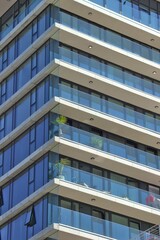 Vertical shot of the facade of an apartment building in an urban area