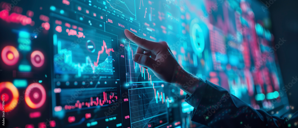 Poster A person is pointing at a computer screen with a red, blue, and green background. The screen displays various graphs and numbers, and the person's finger is hovering over one of them