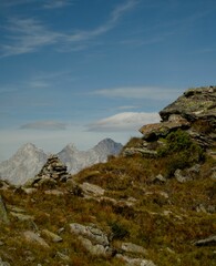 Beautiful scenery of a rocky mountainous landscape in cloudy sky background in Austria