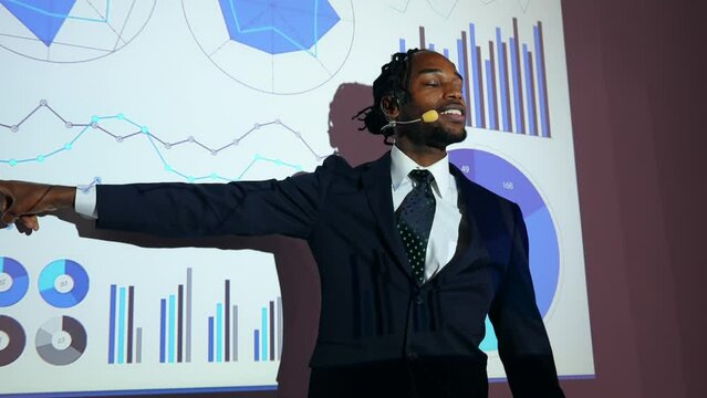 Black man giving a presentation using a projector