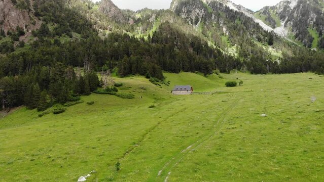 Aerial Drone Footage Pyrenees
 mountains in a sunny day.  Praderas de Colomers. Val d'Aran, Lleida, Spain.