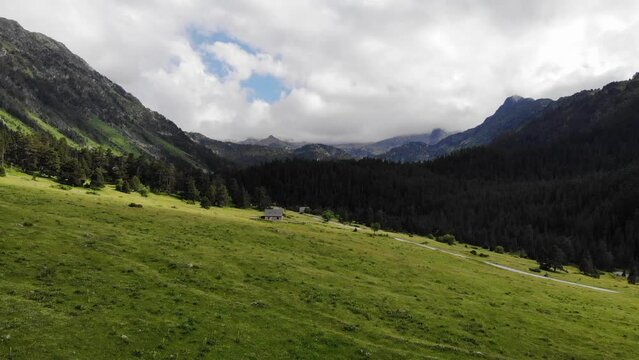 Aerial Drone Footage Pyrenees
 mountains in a sunny day.  Praderas de Colomers. Val d'Aran, Lleida, Spain.