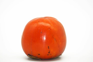 Closeup shot of a persimmon fruit isolated on a white background