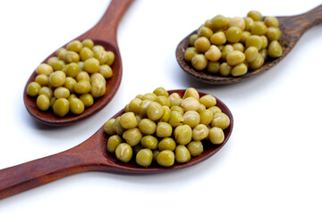 Canned green peas on white background.