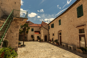 Fototapeta na wymiar View at mediterranean streets and houses in town Sibenik, popular touristic destination in Dalmatia region, Croatia Europe.