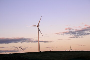 Obraz premium Windmills in USA with sunset