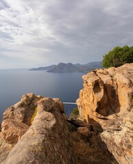 Beautiful landscape of rocky hills with dense foliage on the sunrise