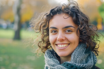 Portrait of a beautiful smiling woman in the park