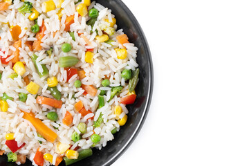 White rice with vegetables in a black bowl isolated on white background. Top view. Copy space - 781977567