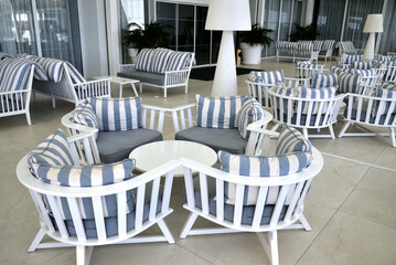 lounge with striped sofas and the tables