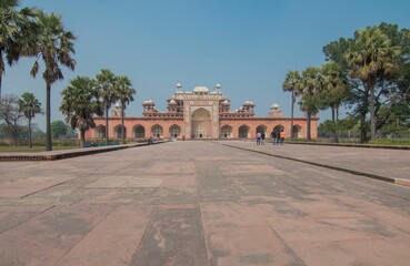 Scenic Akbar's tomb in the distance against the blue sky