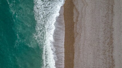 Etretat Beach, France - Aerial View of Turquoise Water and Sandy Shoreline © Wirestock