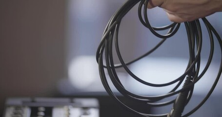 Closeup of wires of audio tech equipment during setting up