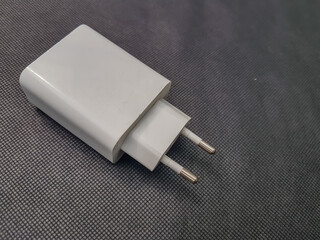 white adapter usb port power cord for phone charging.

