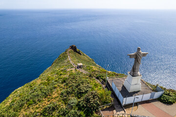 Jesus Christ Statue of Christ the King in Garajau (Cristo Rei ) near Funchal. Aerial drone view - 781984327