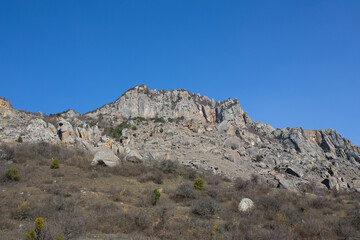 Fototapeta na wymiar Mountains in spring Crimea against a background of blue sky and bright sunlight