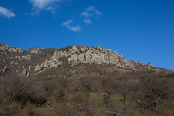 Mountains in spring Crimea against a background of blue sky and bright sunlight