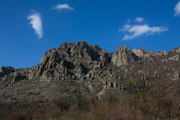Mountains in spring Crimea against a background of blue sky and bright sunlight