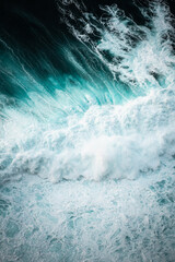 Ocean waves crashing, abstract pattern, top down aerial drone view.