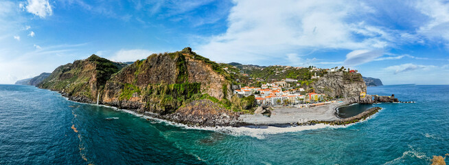 Ponta do Sol in Madeira Island, Portugal. Aerial drone view at cityscape of coastal town and beach - 781988734