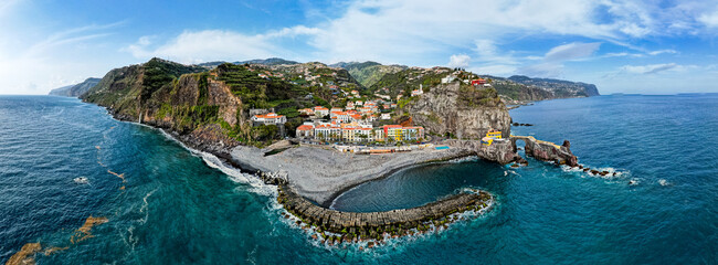 Ponta do Sol in Madeira Island, Portugal. Aerial drone view at cityscape of coastal town and beach - 781989107