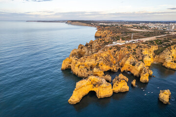 Sunrise over Ponta de Piedade, Algarve cliffs on coastline. Aerial drone view - 781989376