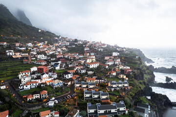 Fototapeta na wymiar Aerial drone view of the coast of Seixal at cloudy dramatic weather, Madeira, Portugal, Europe