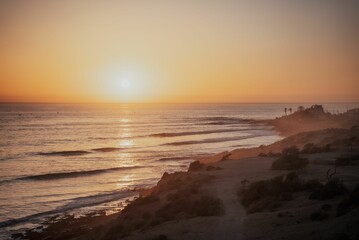 Fototapeta premium Beautiful landscape of the seashore at sunset perfect for wallpapers and backgrounds