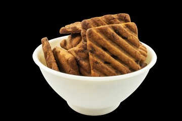 Closeup of seek biscuits in white bowl
