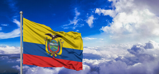 Ecuador national flag cloth fabric waving on beautiful Blue Sky Background.