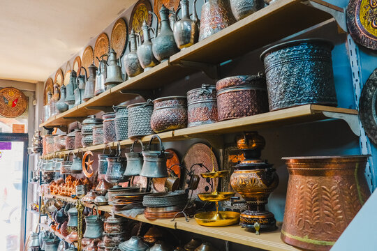 copper embroidered handicrafts on the shelf for sale, copper pots, pans, jugs